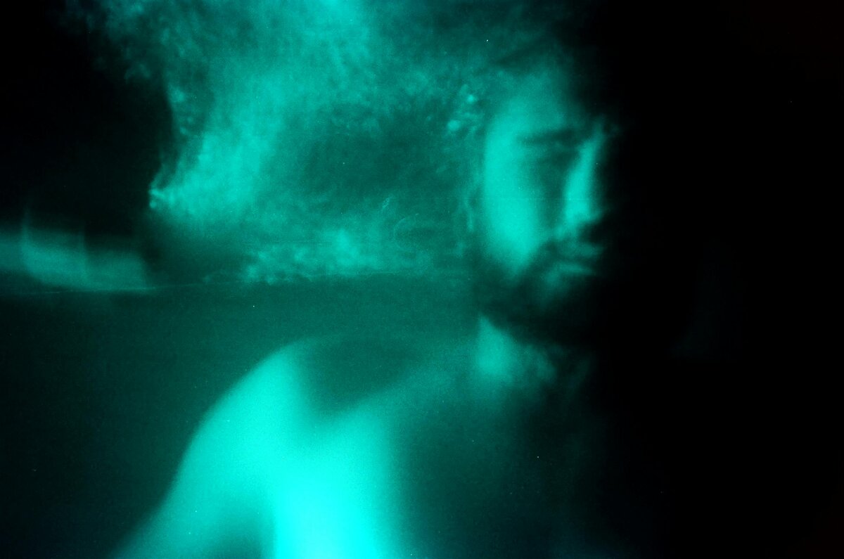 Ethereal turquoise smoke clouds swirling in atmospheric dreamlike void